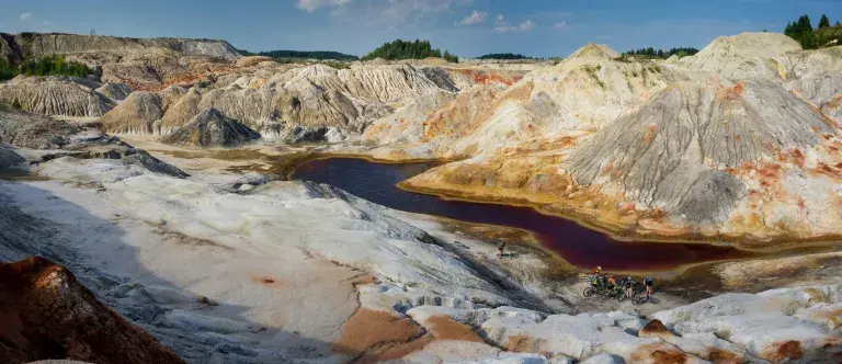 Landscape of a mine with mountains and a river flowing through © Unsplash