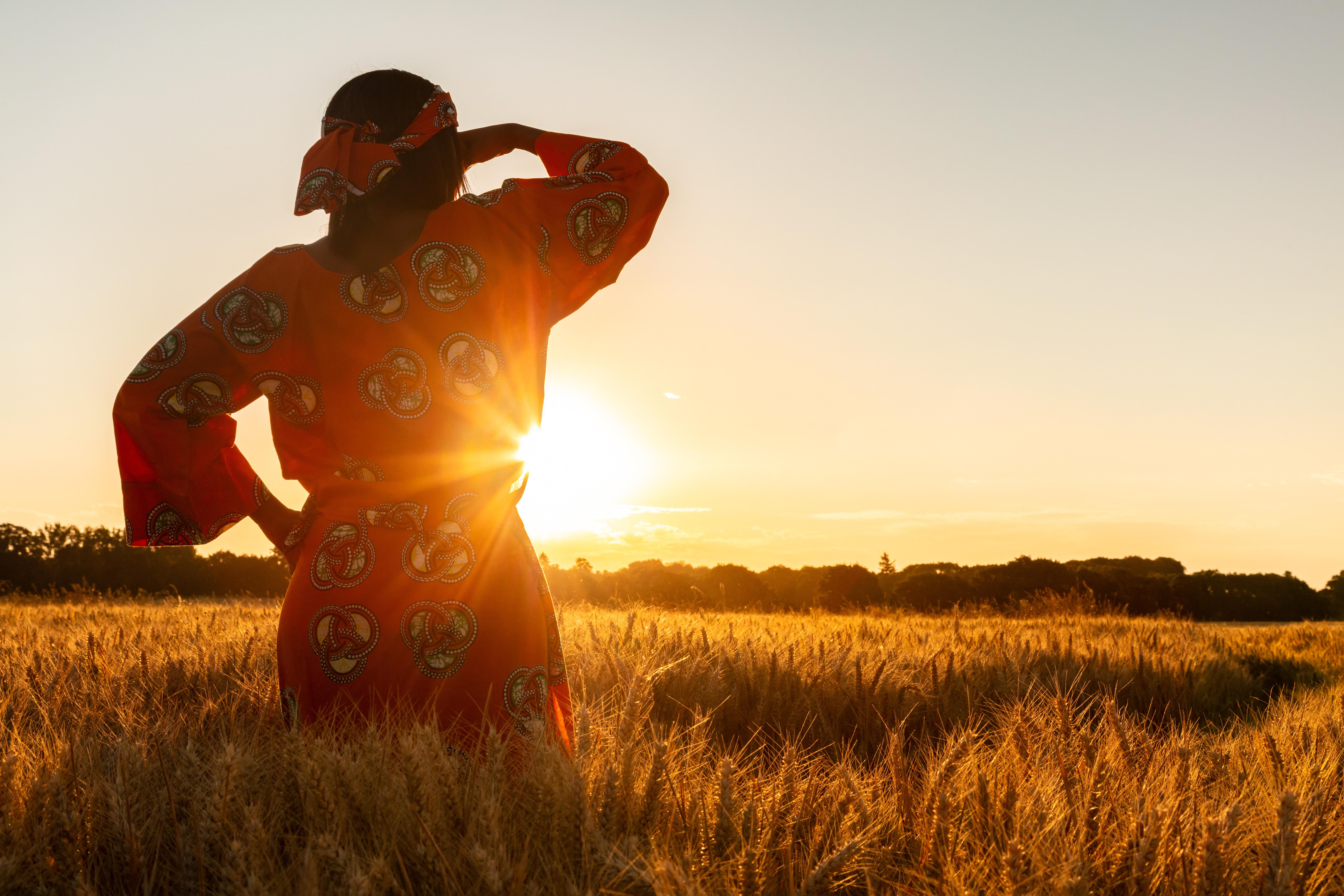 Woman looking out over field